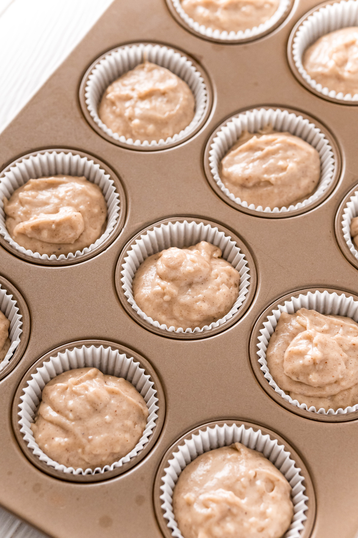 unbaked donut muffins in a cupcake tin