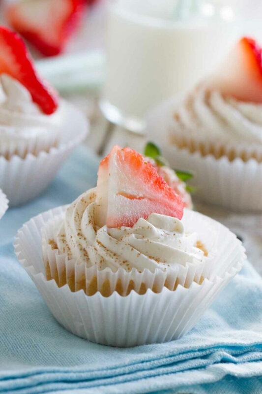 Tres leches cupcake with a strawberry on top