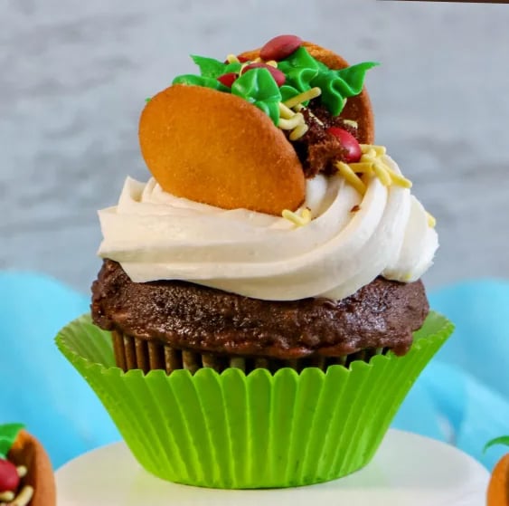 chocolate cupcake with a Vanlla wafer taco on top