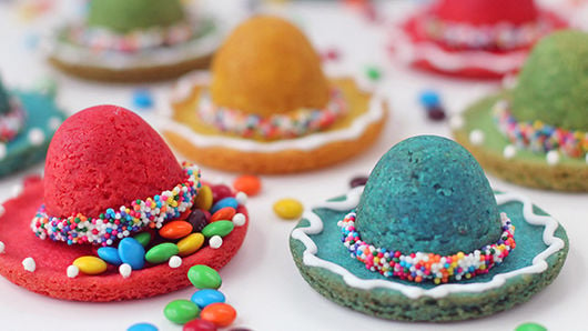 colorful cookies that look like sombreros with sprinkles
