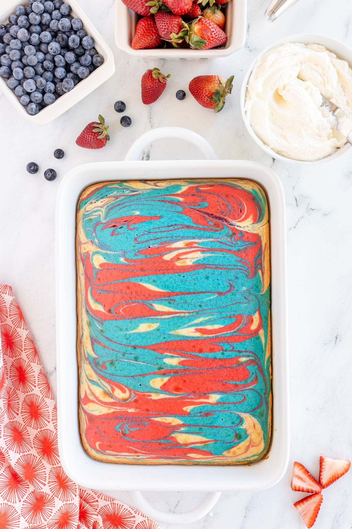 red white and blue swirl cake in a pan