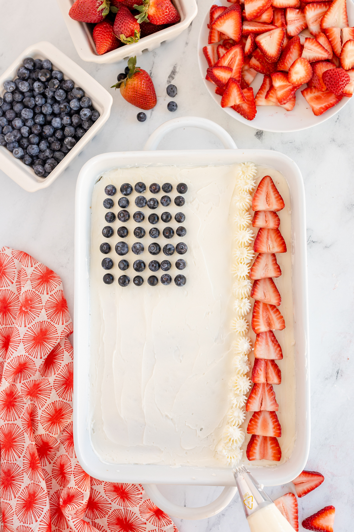 partially decorated flag cake