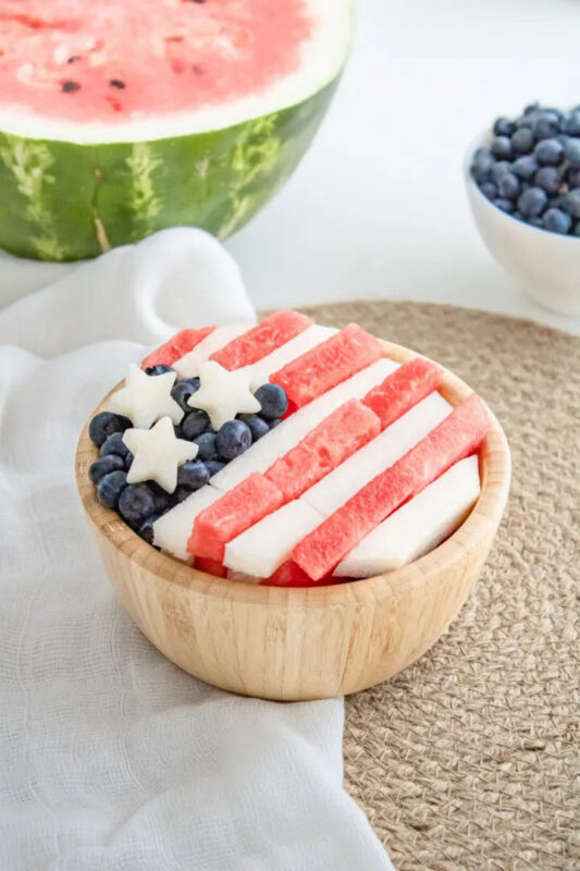 wood bowl with a 4th of July salad
