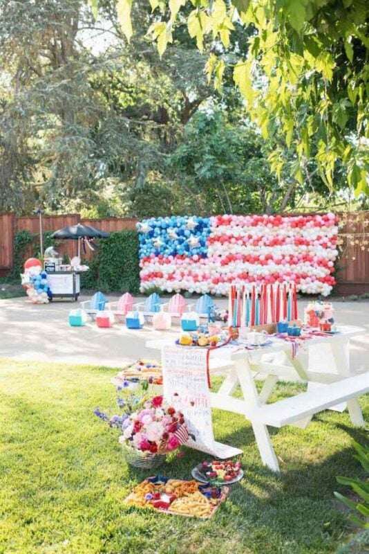 white table with a balloon flag in the background