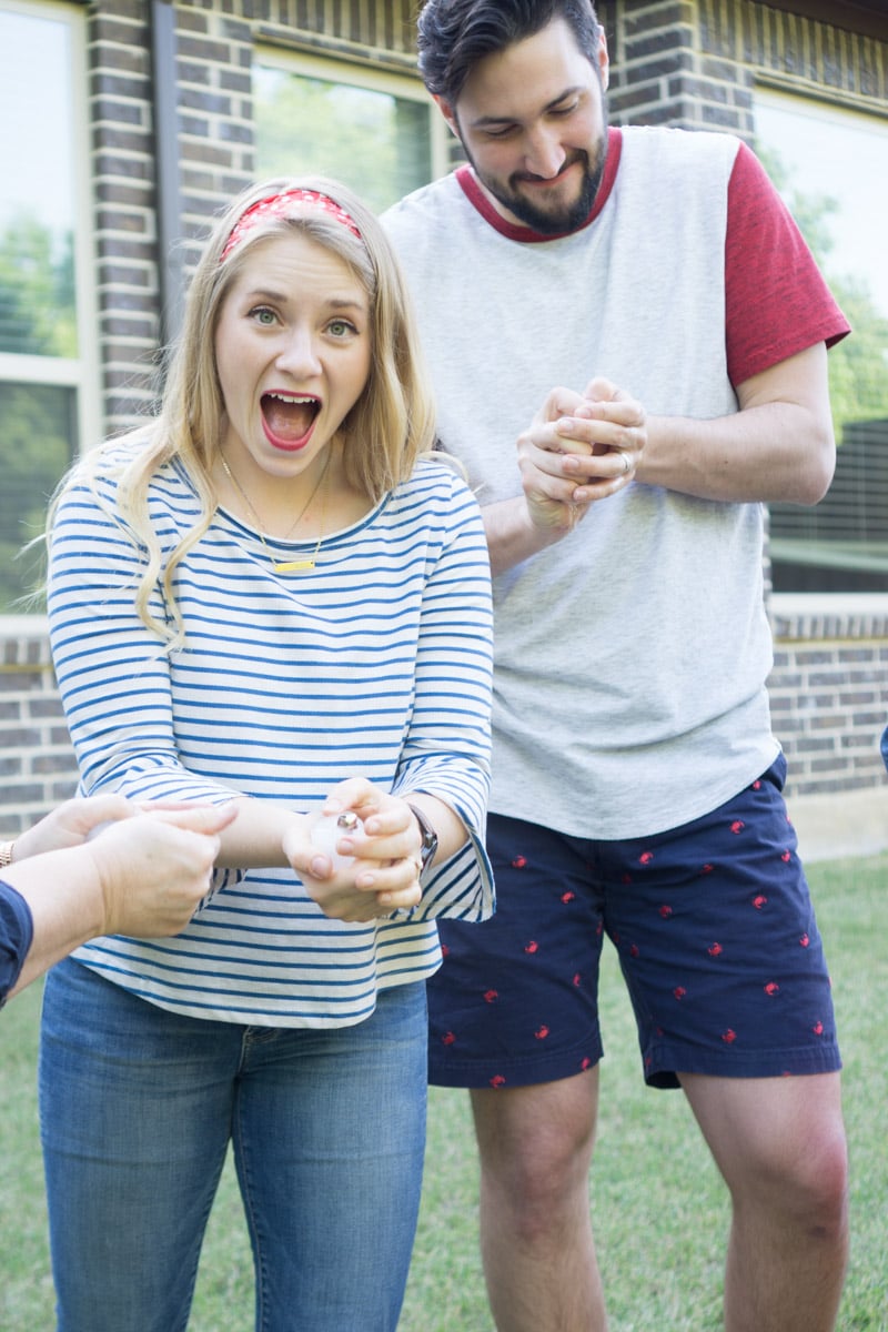 Adults holding a cup of ice