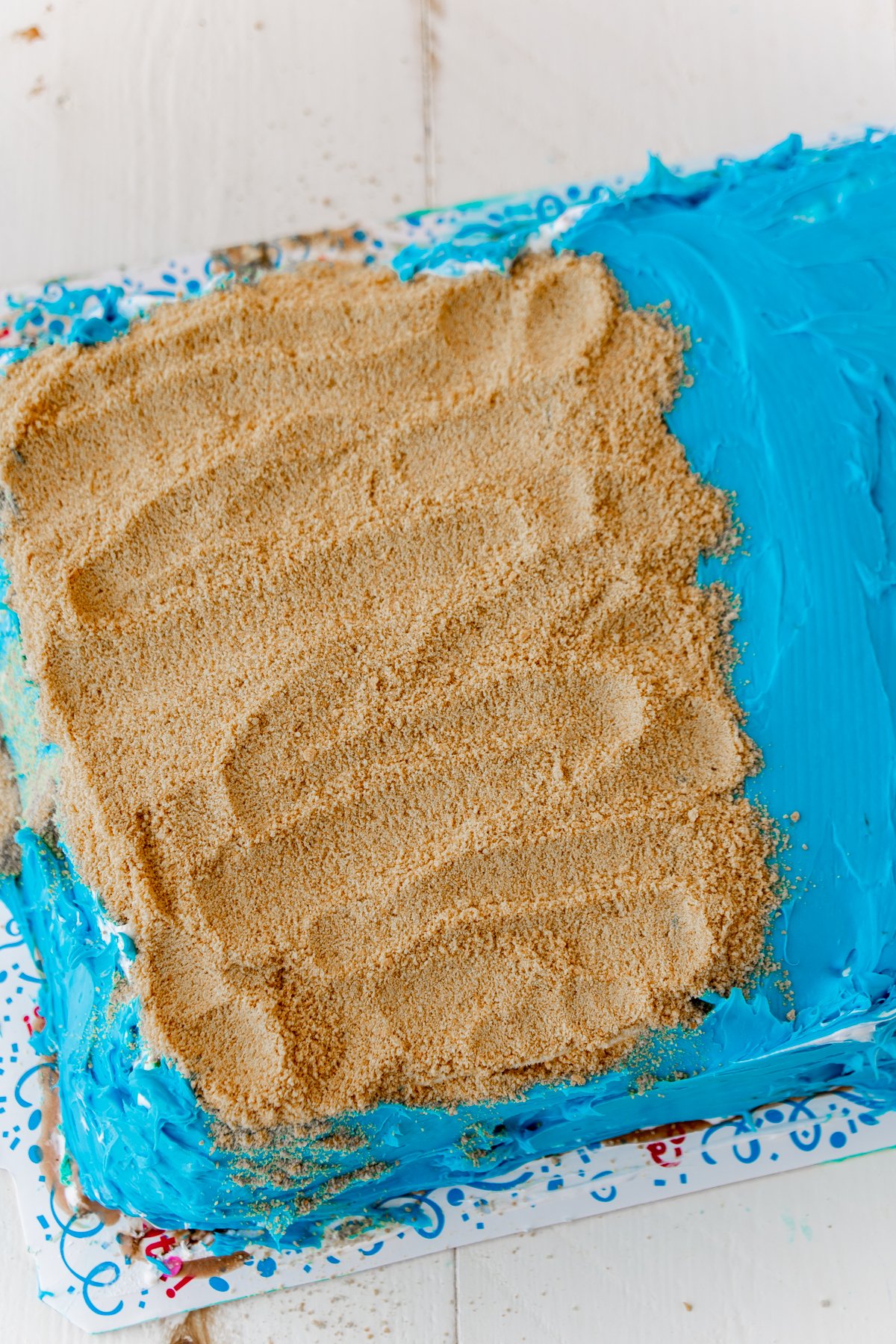 Graham cracker crumbs on an ice cream cake