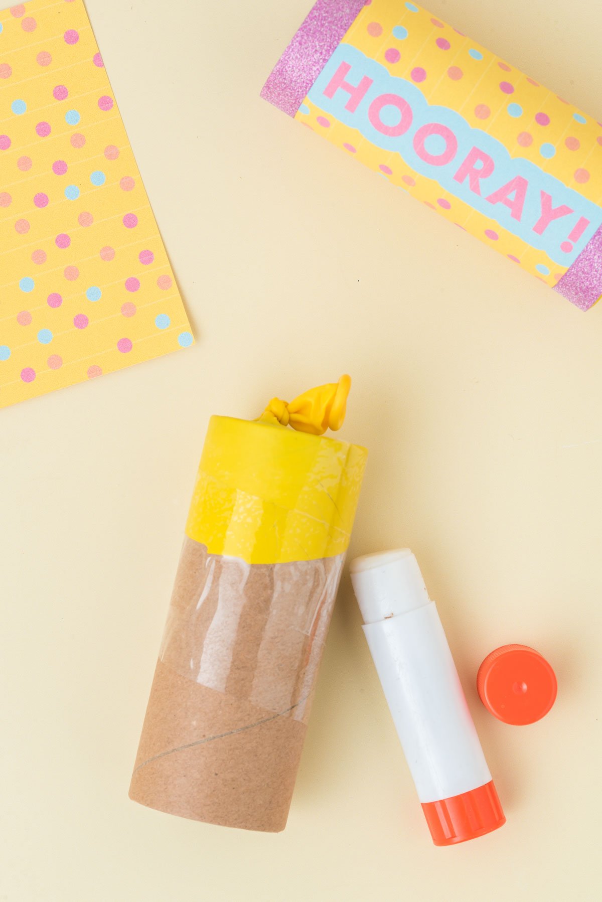 balloon taped around a toilet paper roll