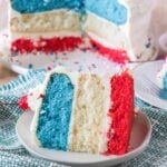 a slice of red white and blue cake on a white plate