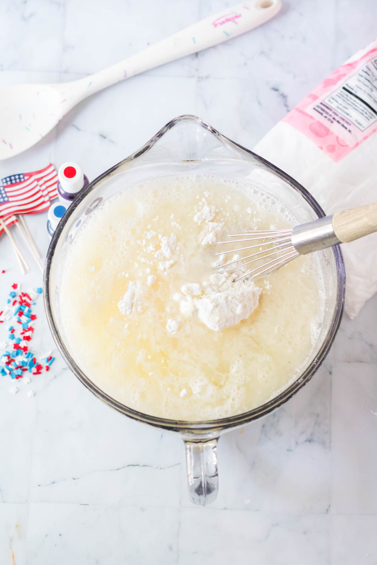 white cake mix in a glass mixing bowl