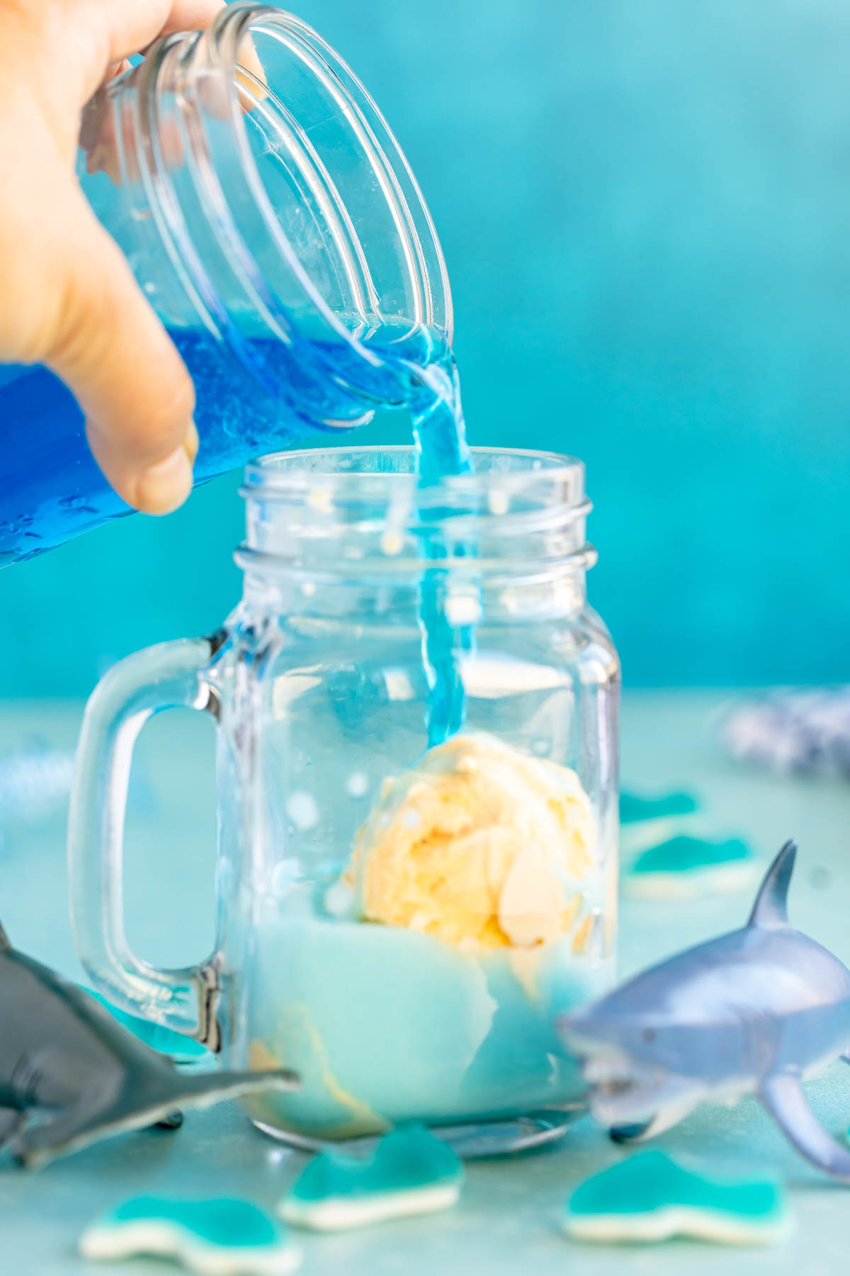 pouring blue punch over ice cream