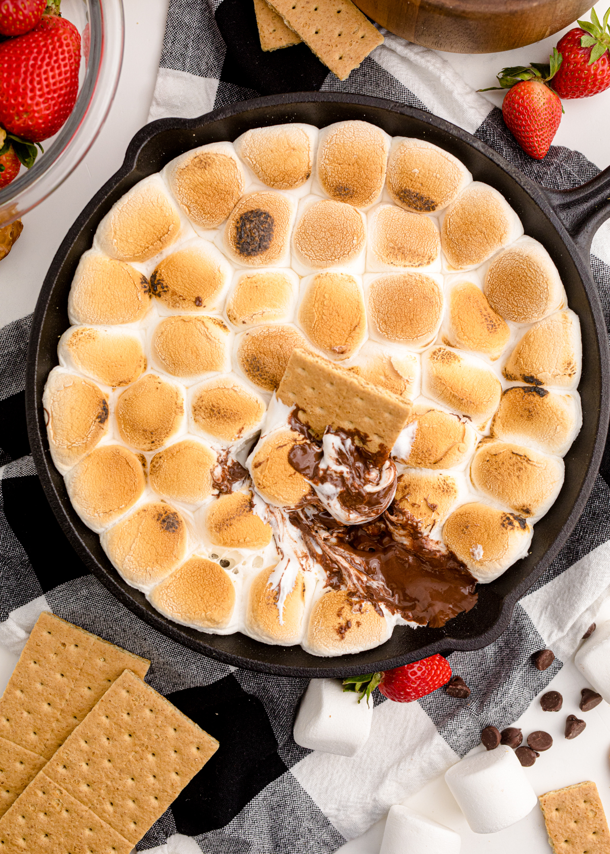 s'mores dip with a graham cracker on top
