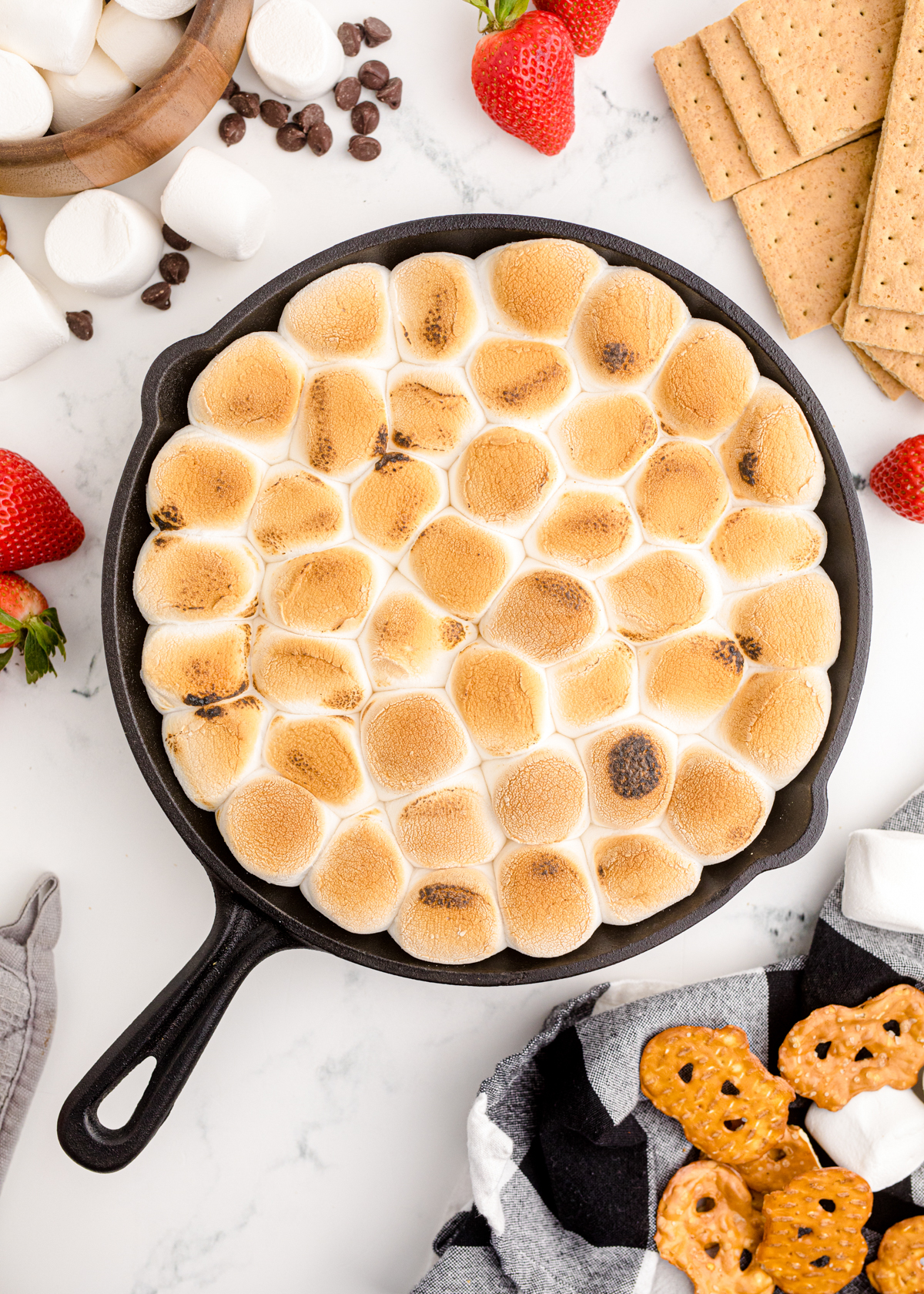 oven baked s'mores dip in a cast iron skillet