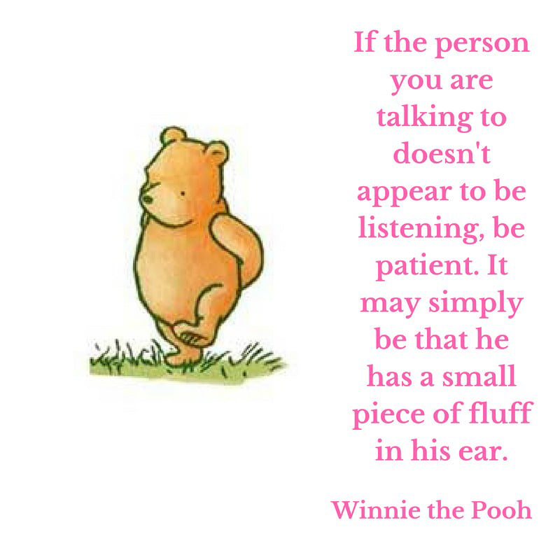 pooh standing next to a winnie the pooh quote