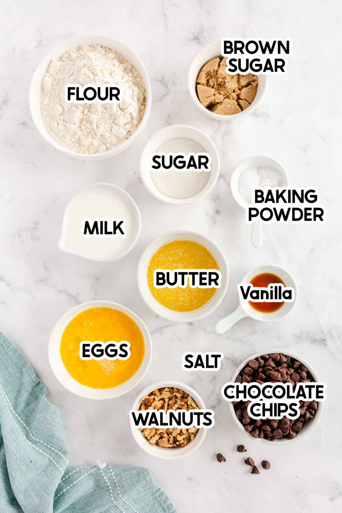 ingredients to make chocolate chip muffins with labels