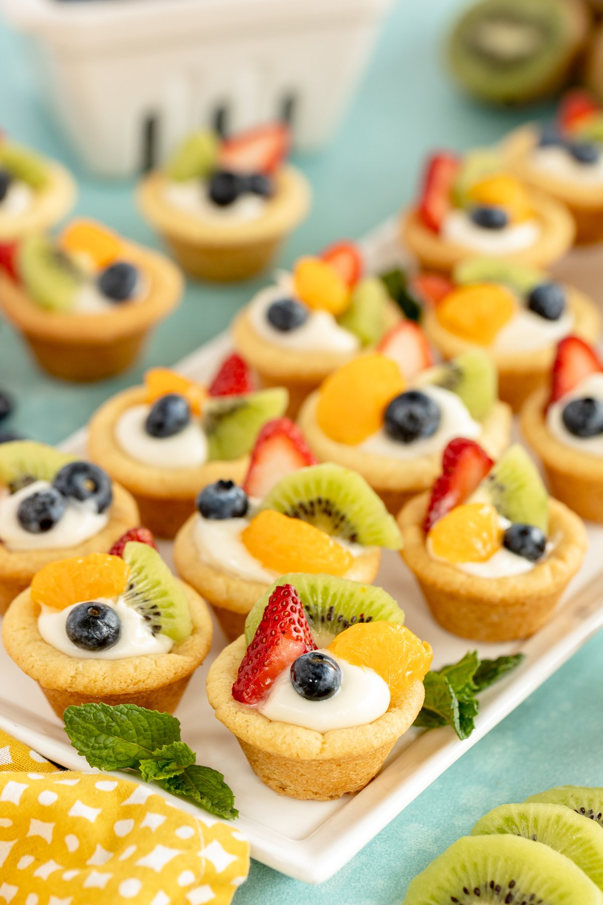 plate full of mini fruit tarts