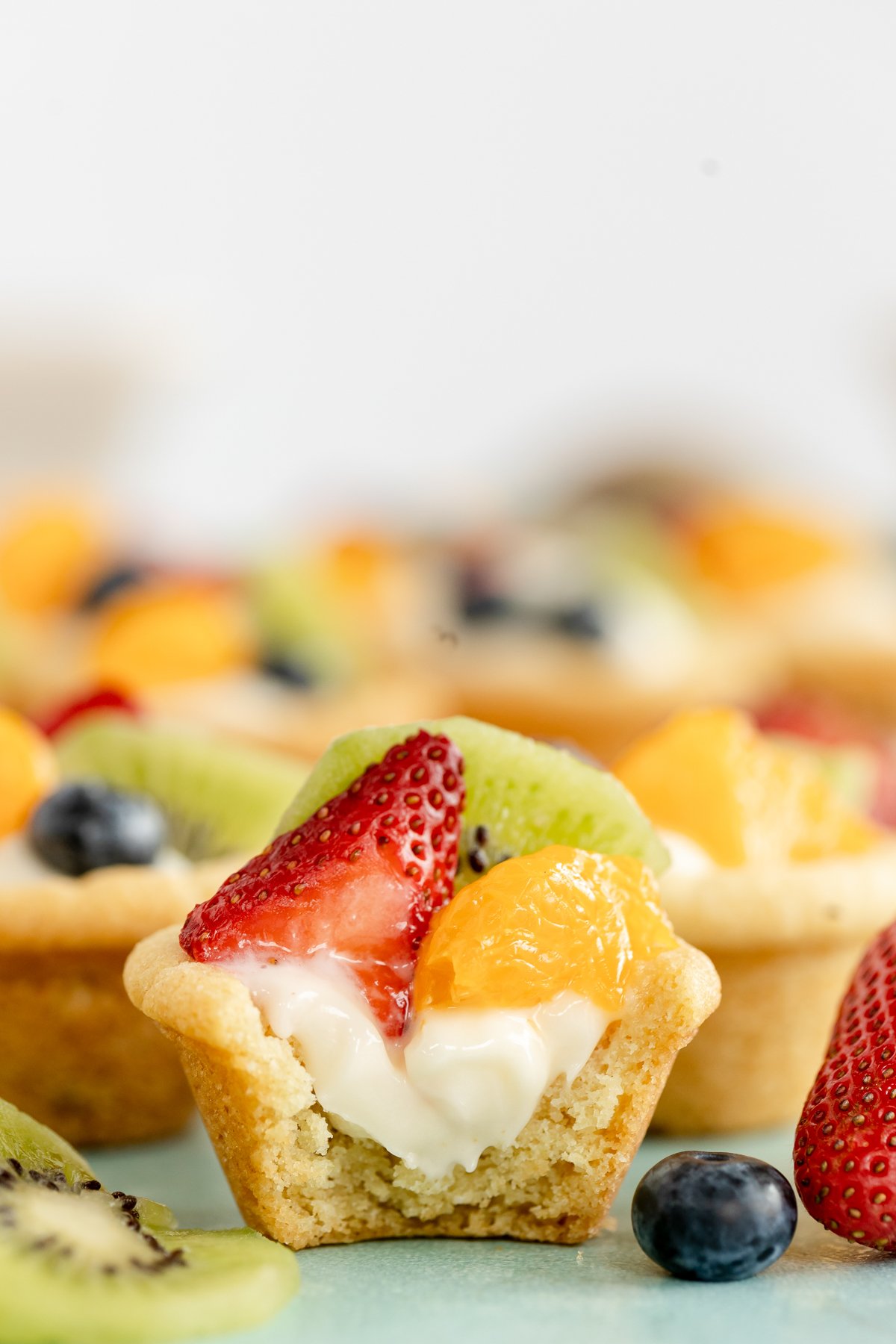 mini fruit tart with a bite out of it