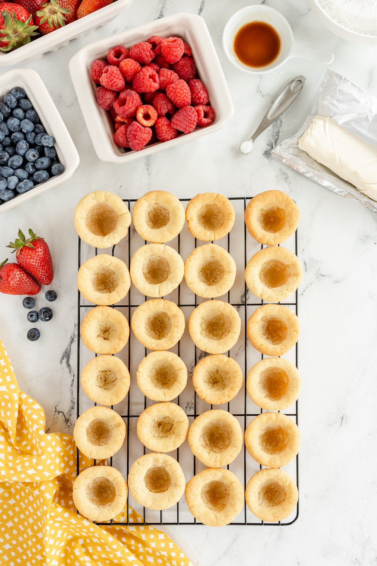 sugar cookie cups cooling on a wire rack