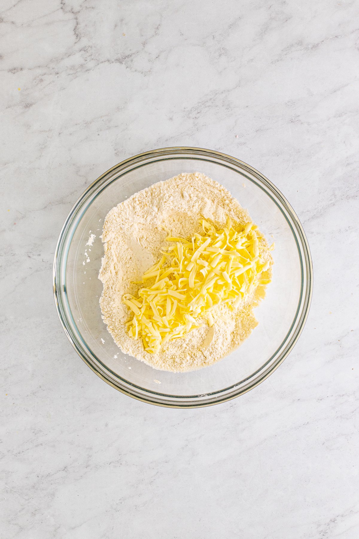 glass bowl with grated butter