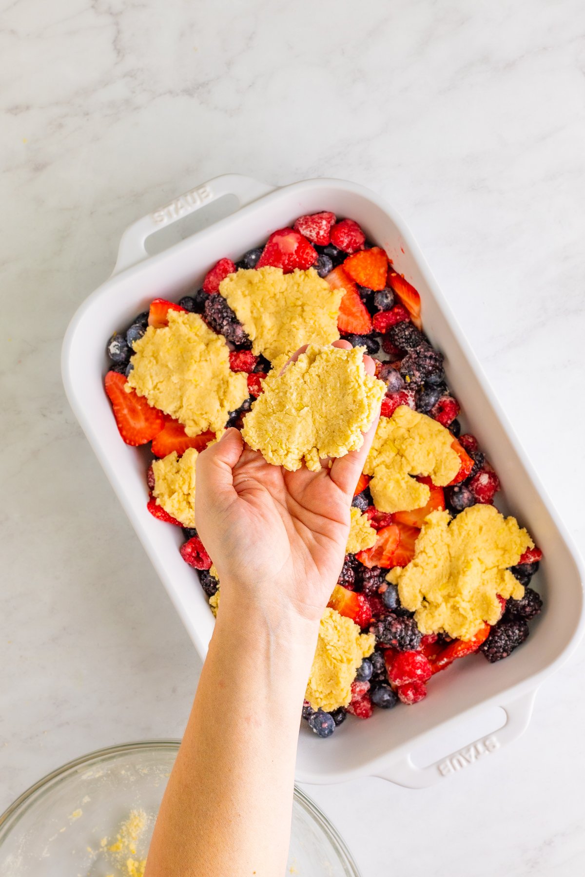 hand holding cobbler topping