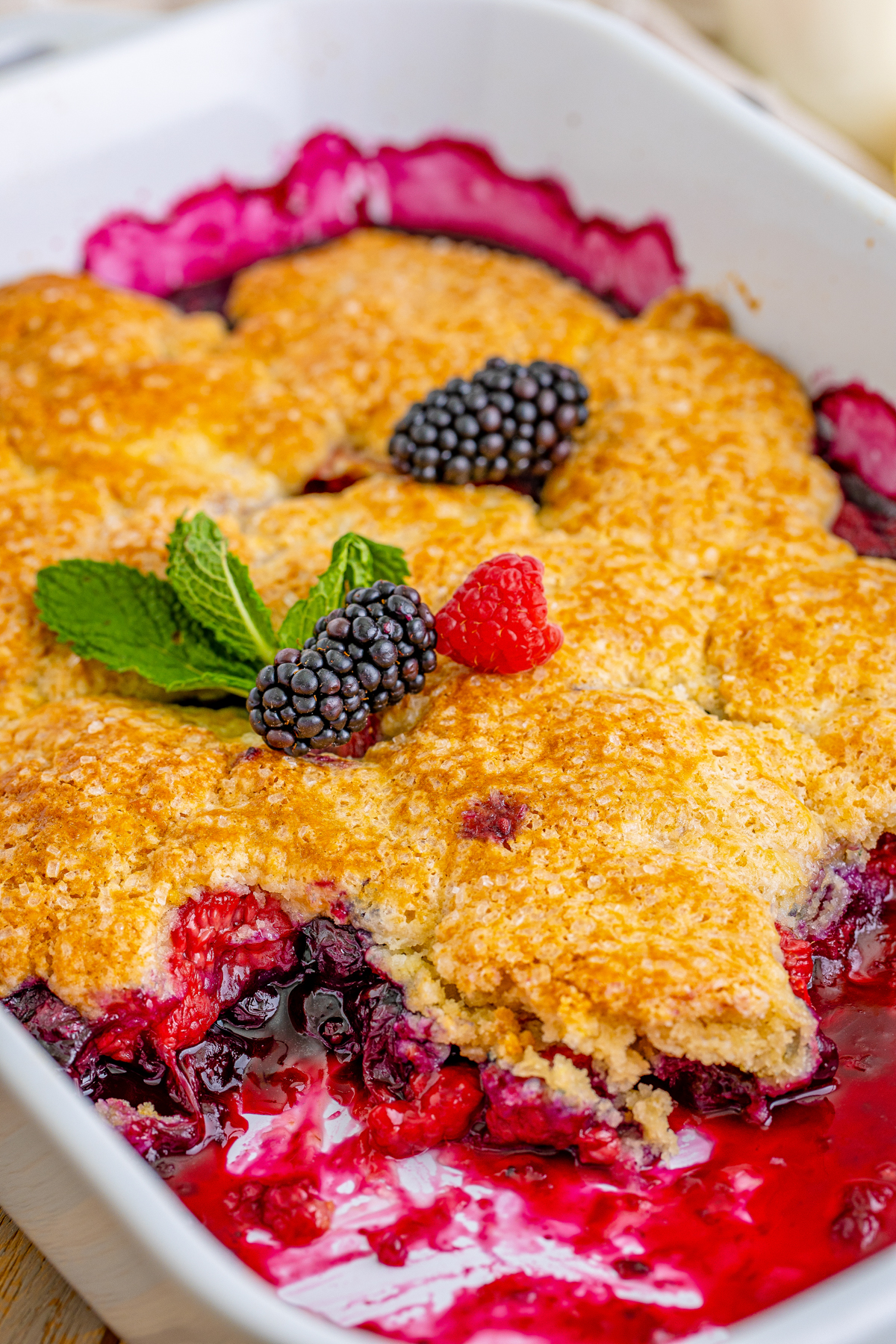 baking dish with mixed berry cobbler