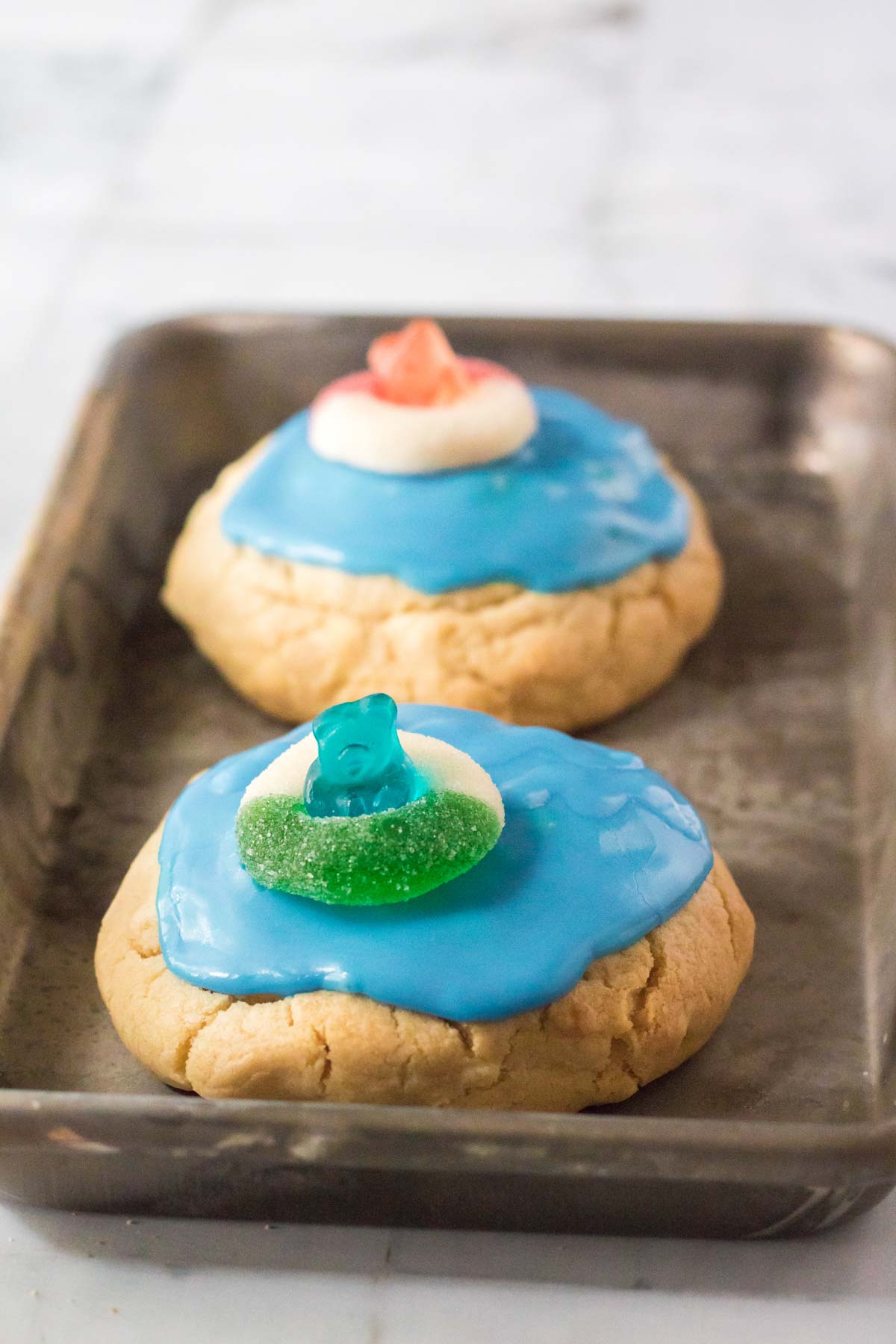 iced pool party cookies on a baking sheet