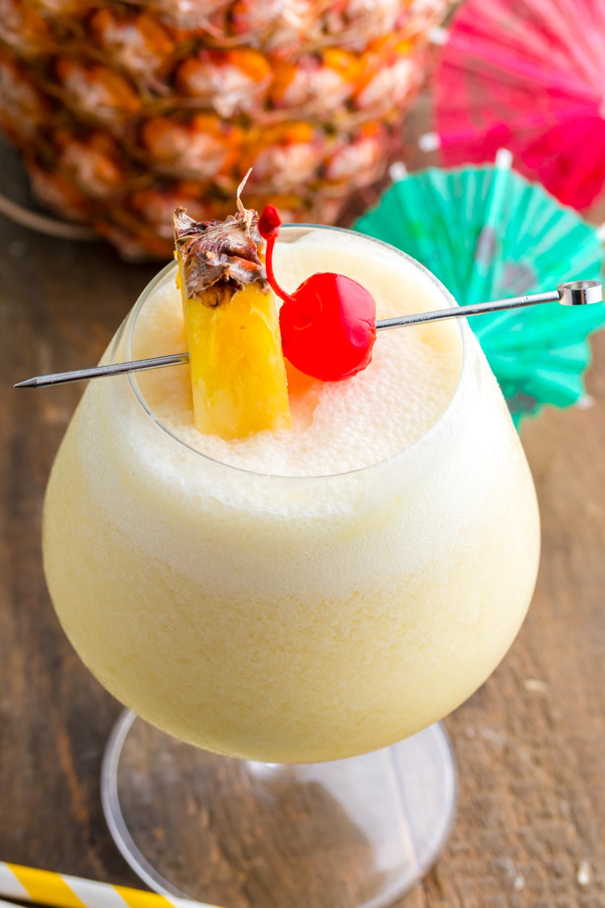 virgin pina colada with pineapple and cherry on top