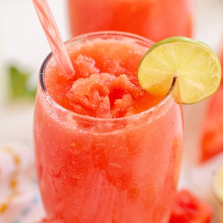 Watermelon slushie with a lime wedge garnish