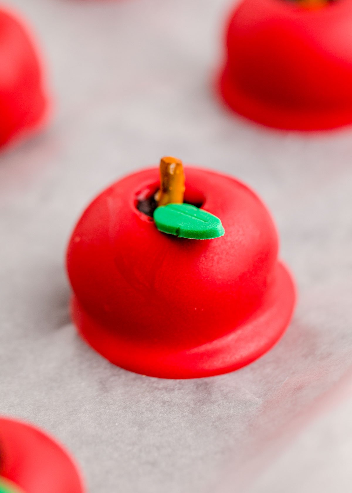 apple shaped oreo balls with a fondant leaf