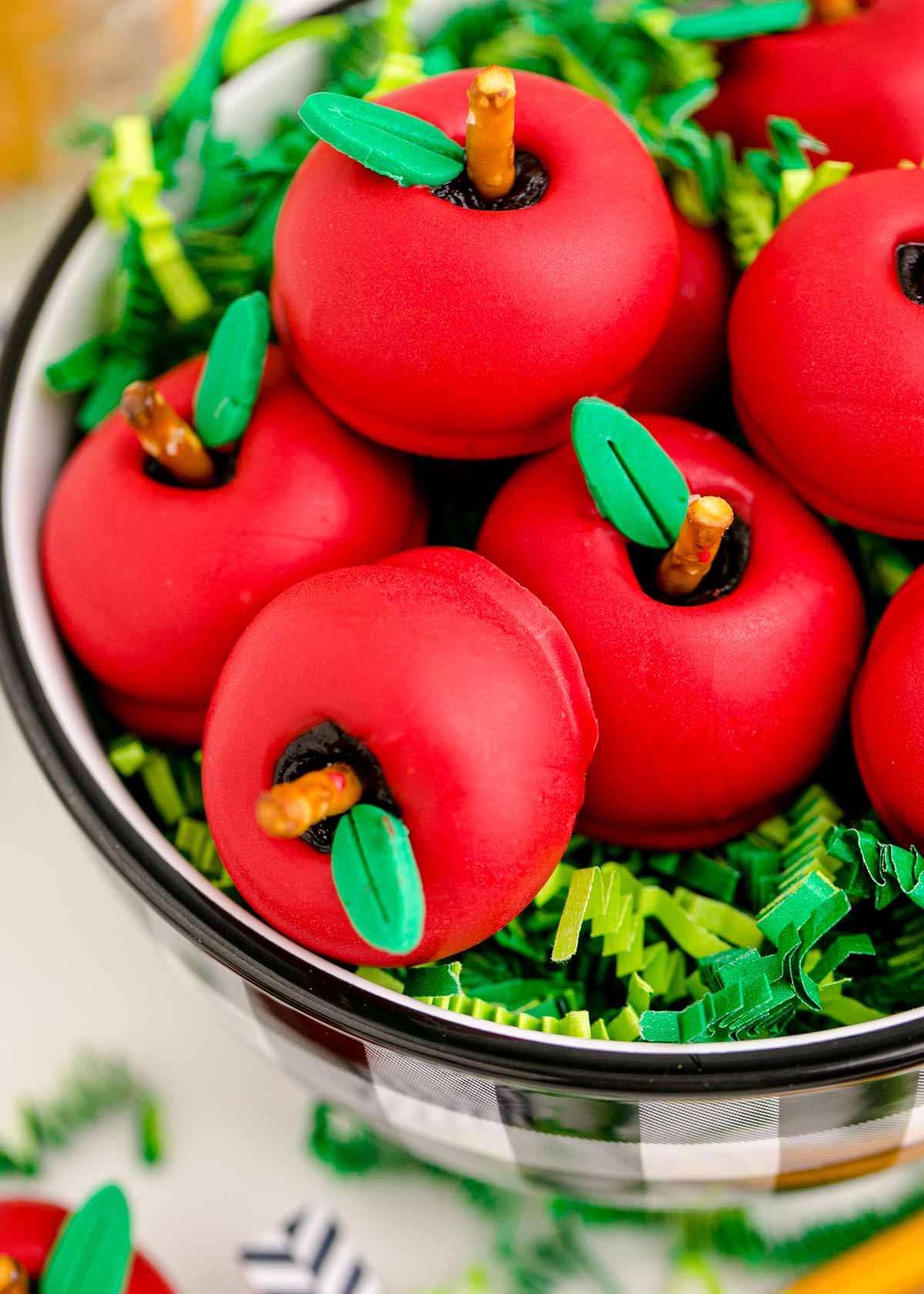 apple shaped Oreo balls in a black and white bowl