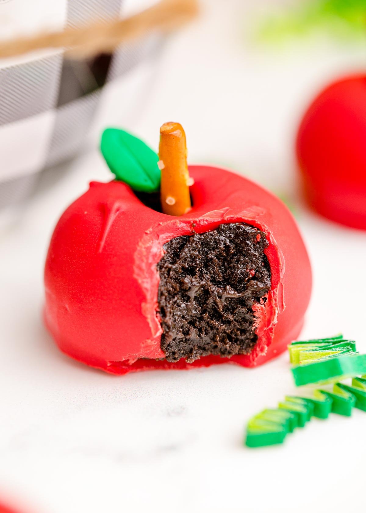 apple shaped Oreo ball with a bite taken out of it