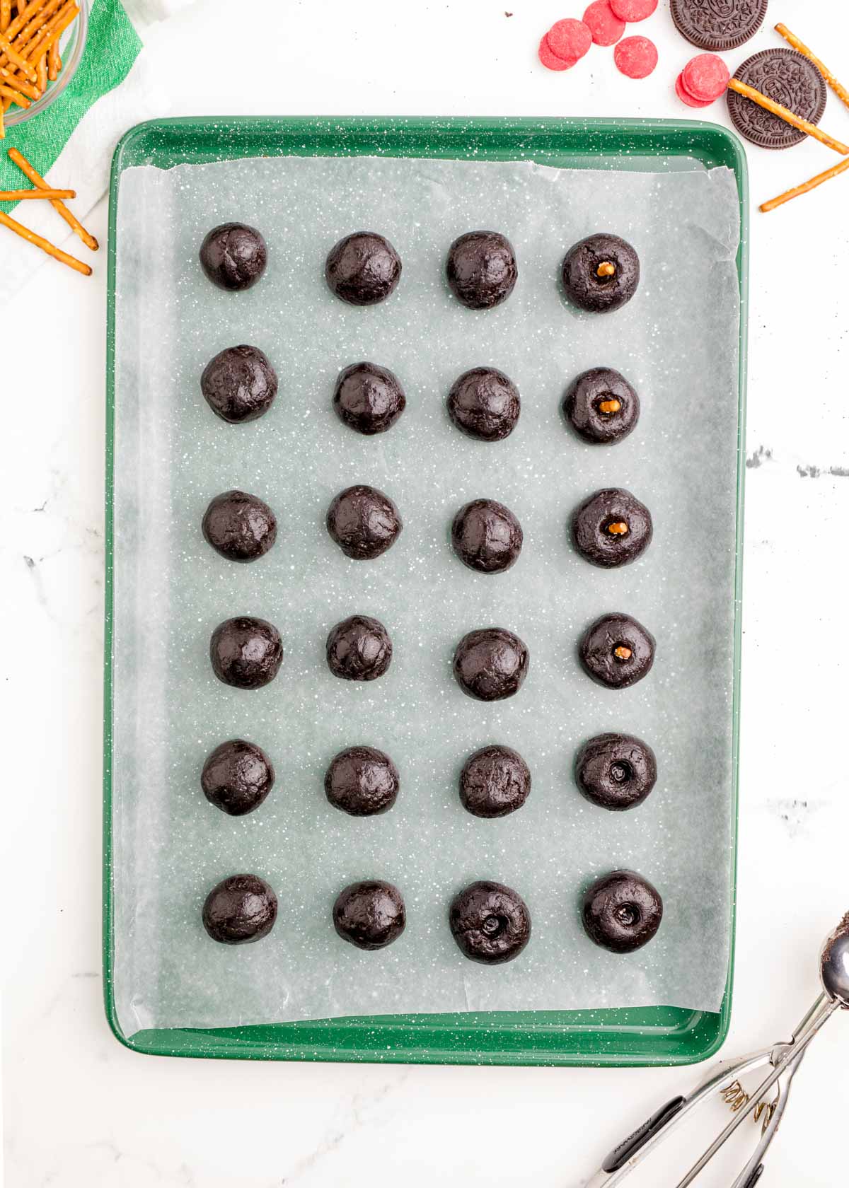 no bake Oreo balls in lines on a baking sheet