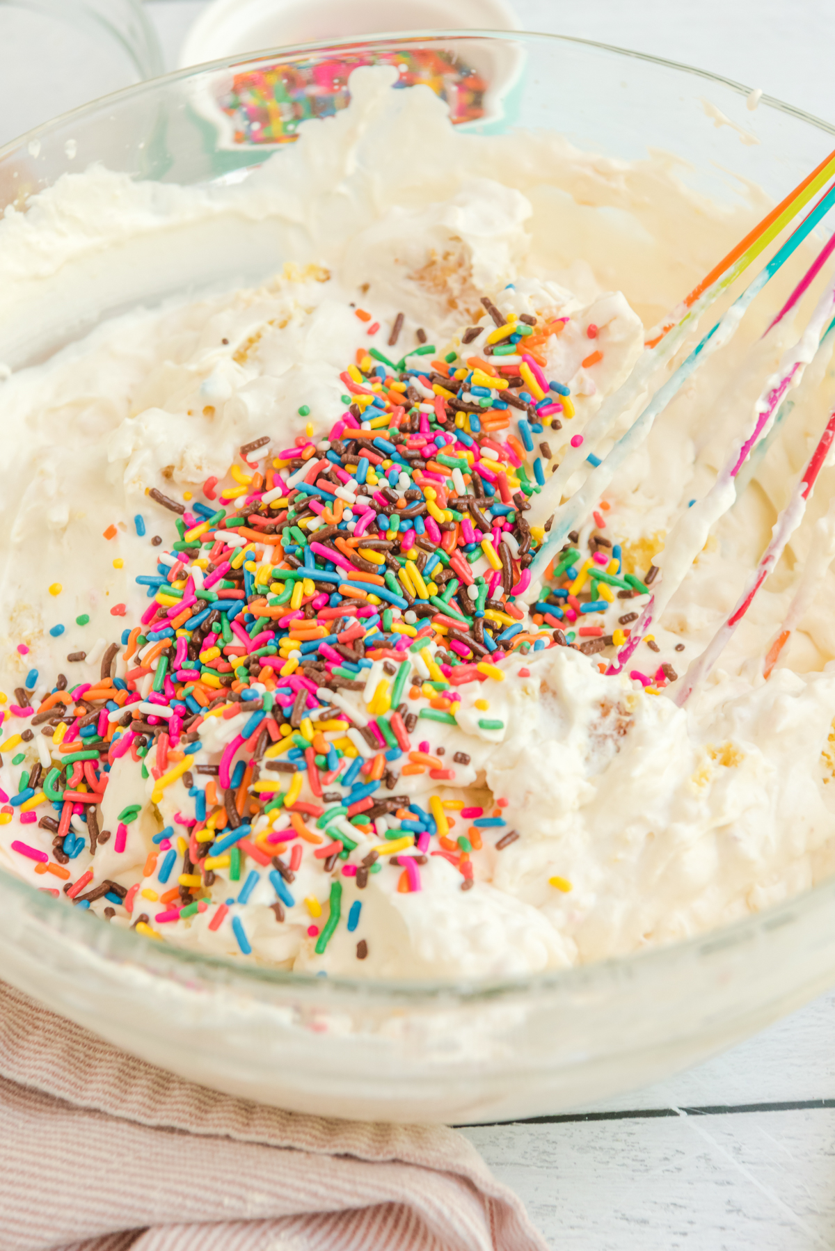 sprinkles in a bowl of ice cream batter