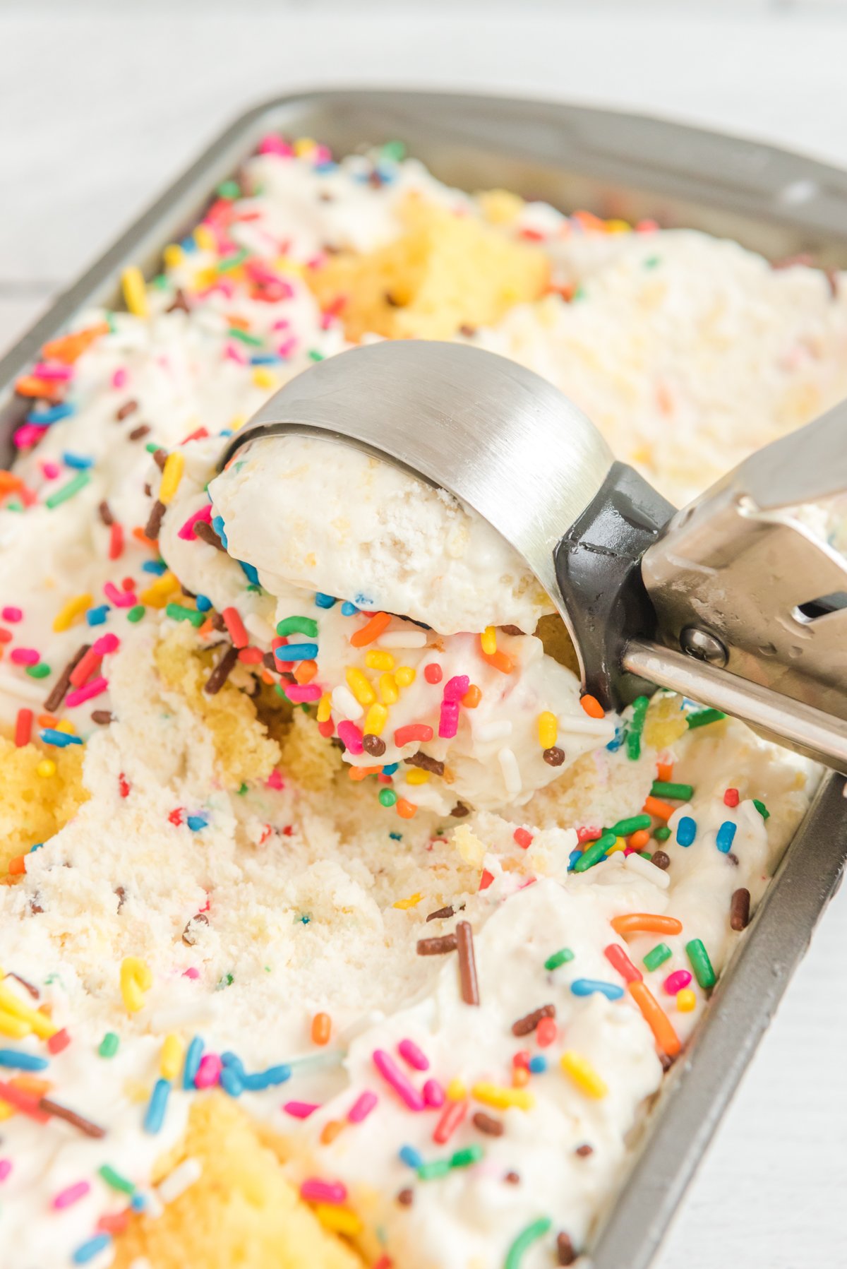 birthday cake ice cream with an ice cream scooper