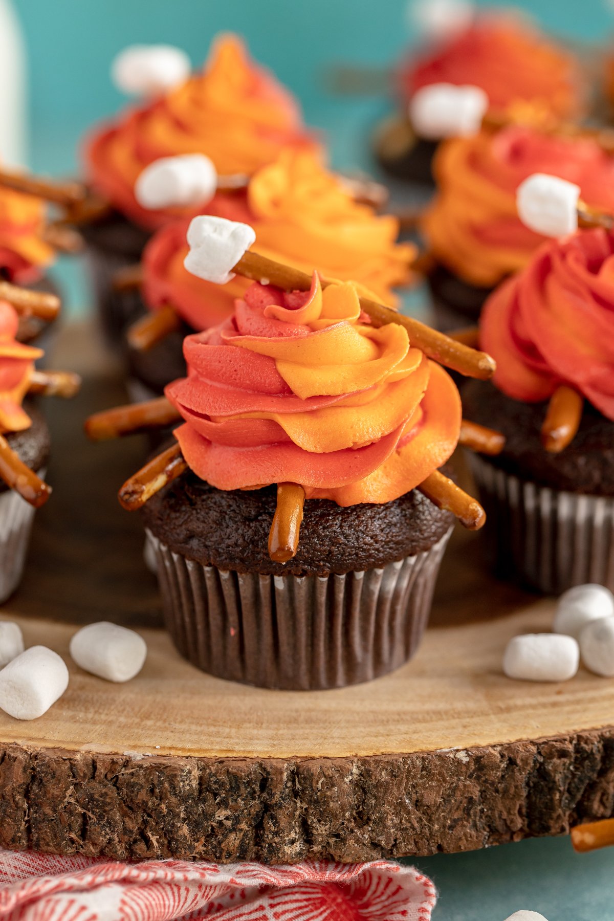 campfire cupcakes on a wood platter