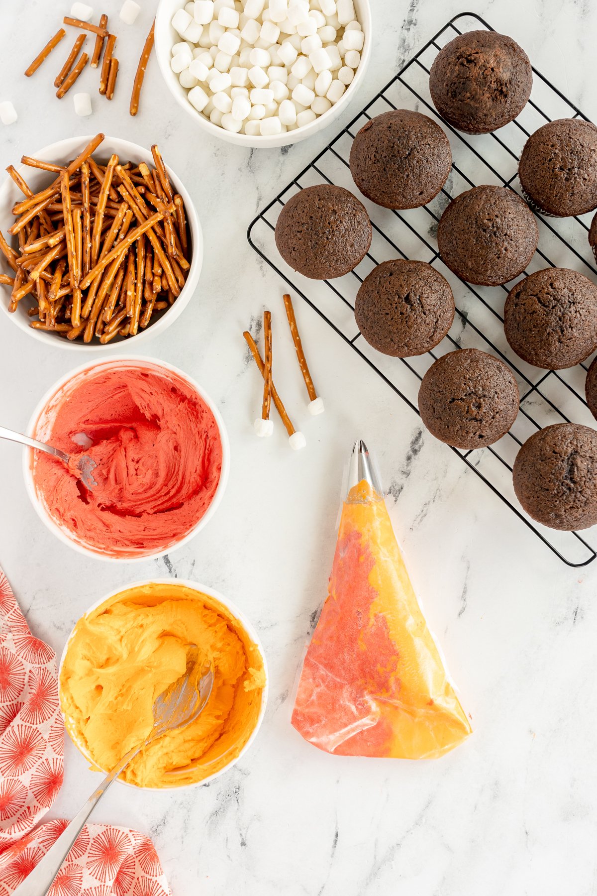 piping bag with orange and red frosting