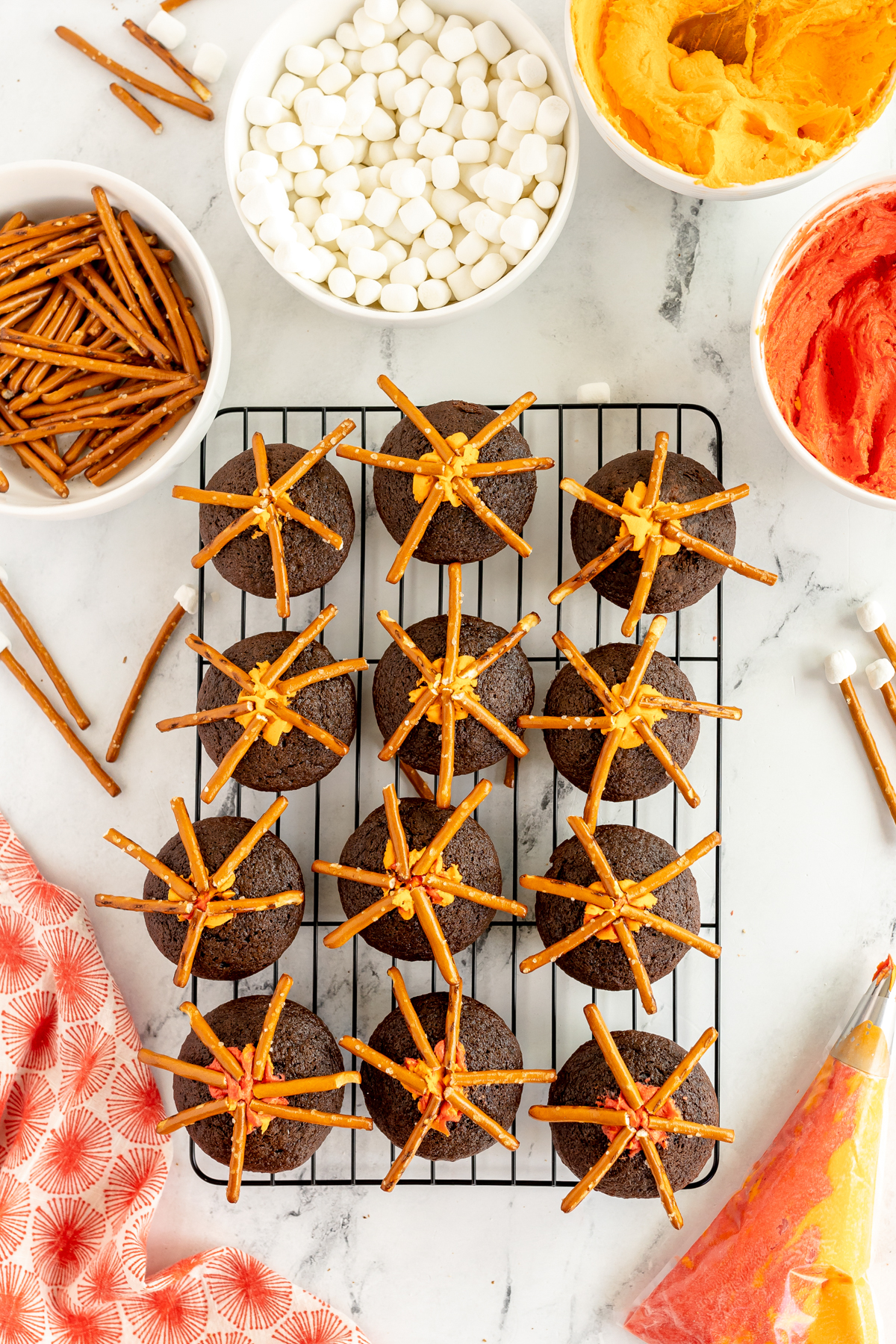 chocolate cupcakes with pretzel sticks