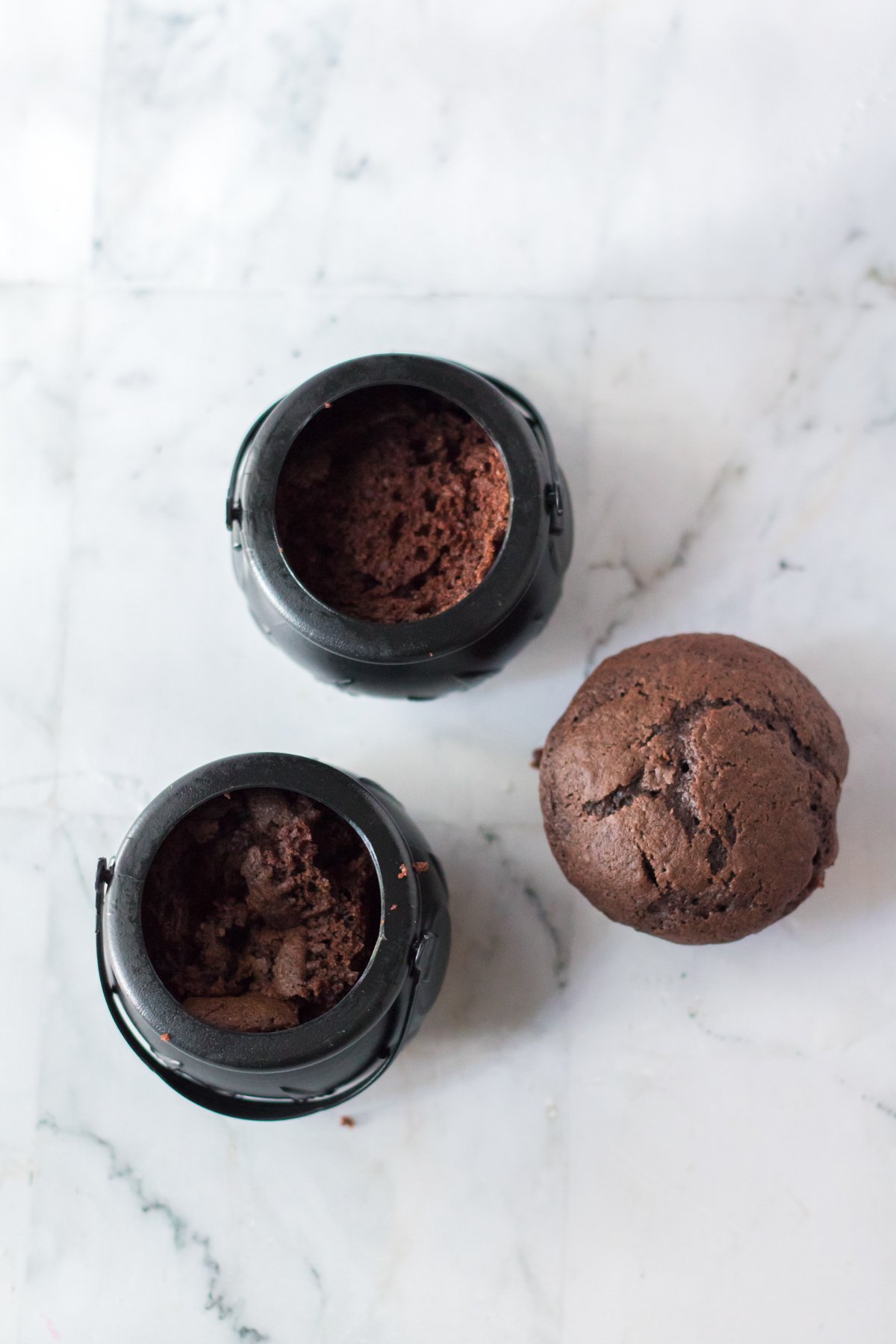 chocolate cupcakes in plastic cauldrons