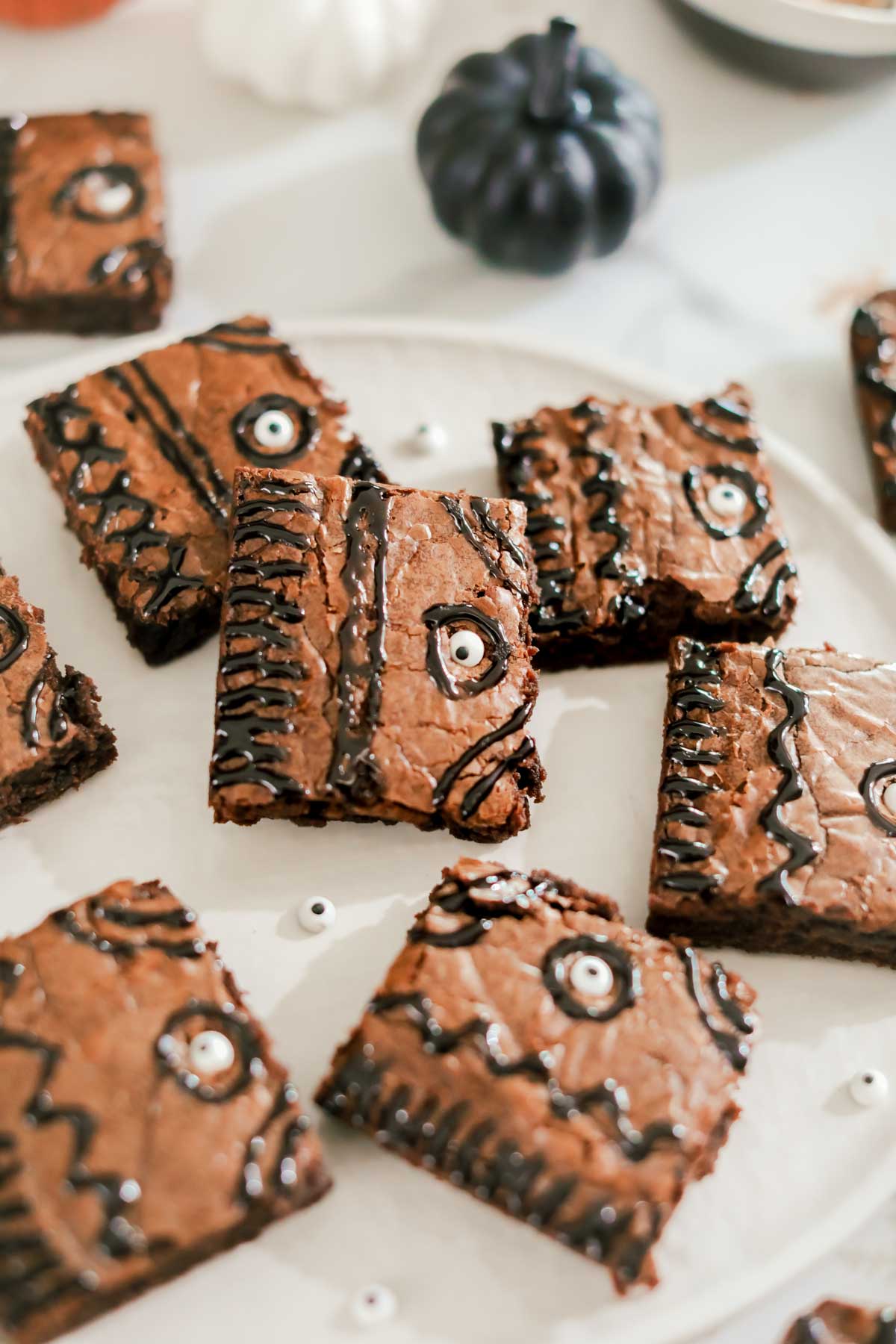 stack of hocus pocus brownies on a plate