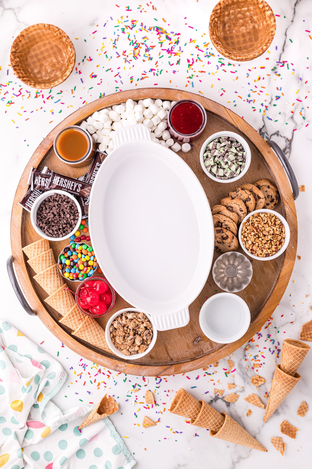 ice cream sundae bar toppings on a board