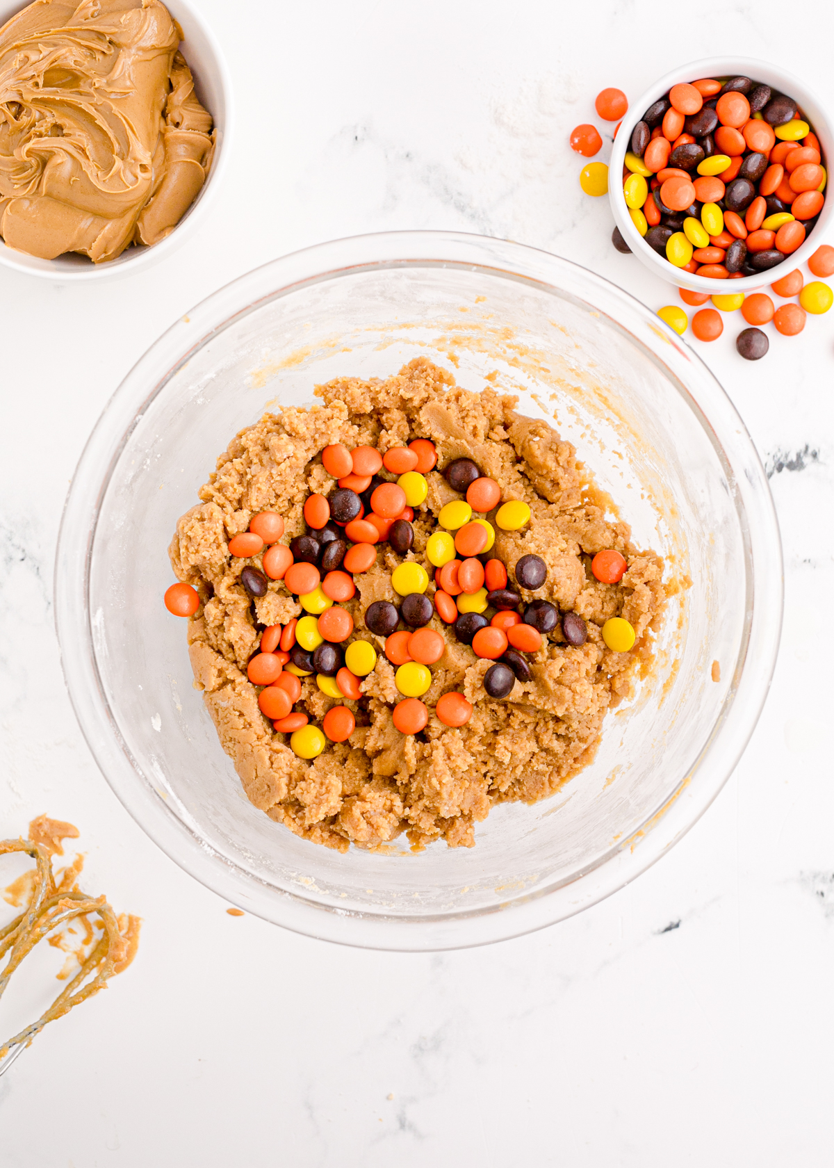 glass bowl with reese's pieces cookie dough batter