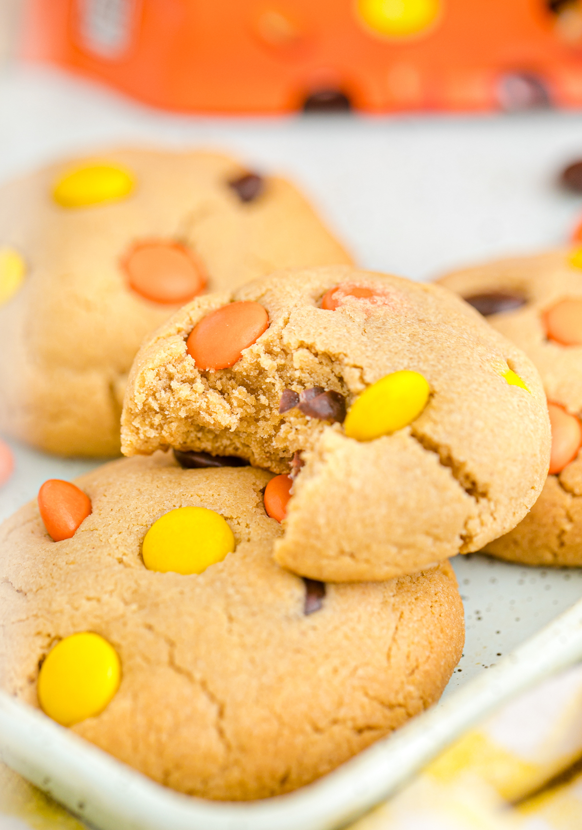 Reese's pieces cookies with a bite taken out of it