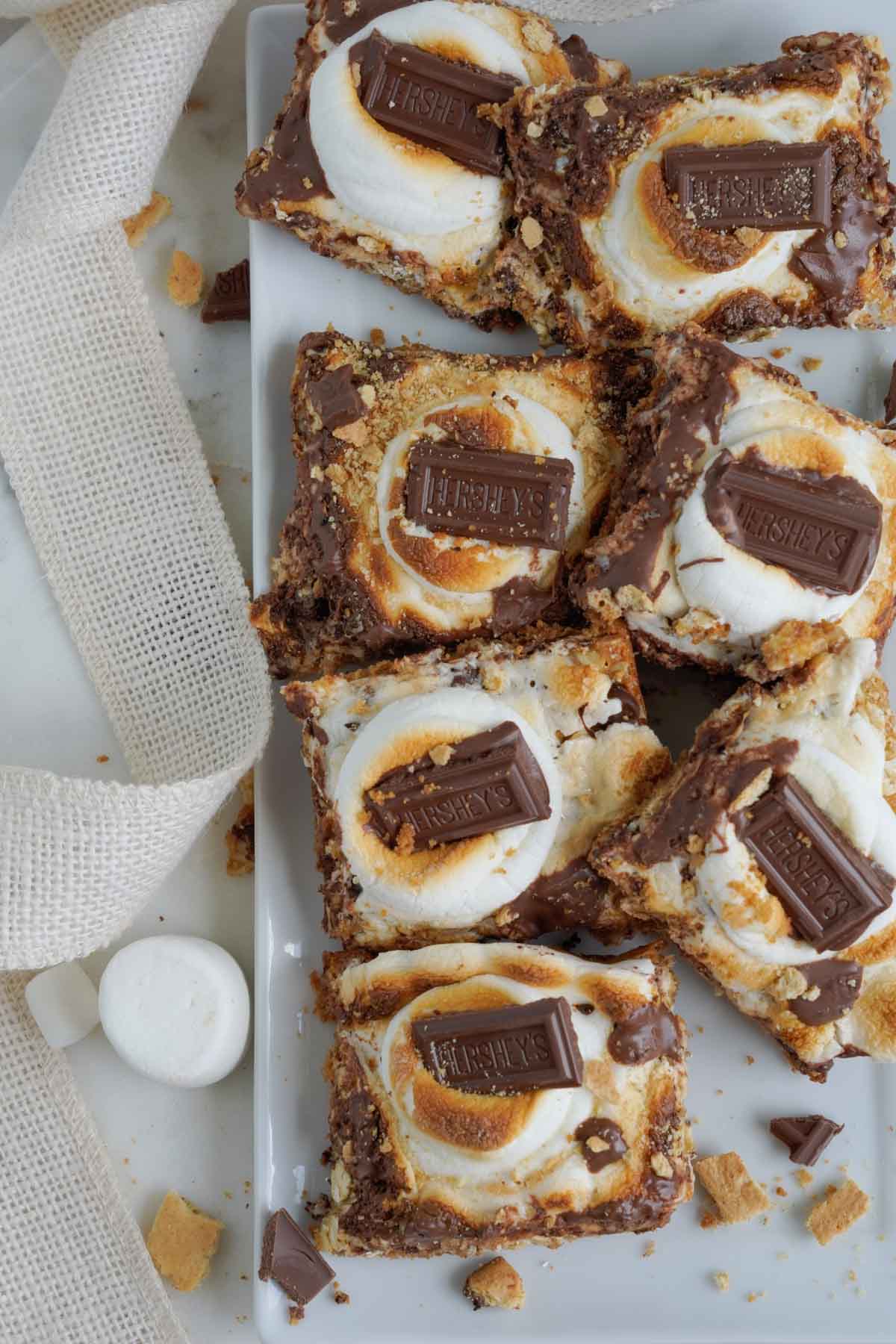 magic s'mores bars on a white plate