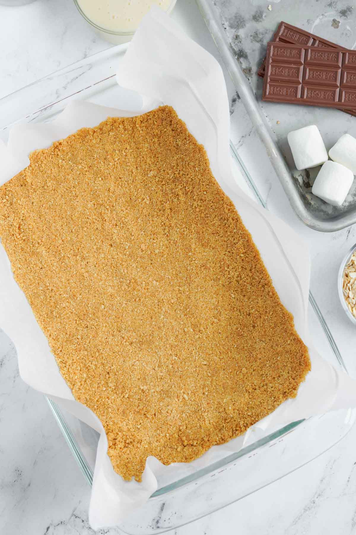 graham cracker crumb crust in a baking pan
