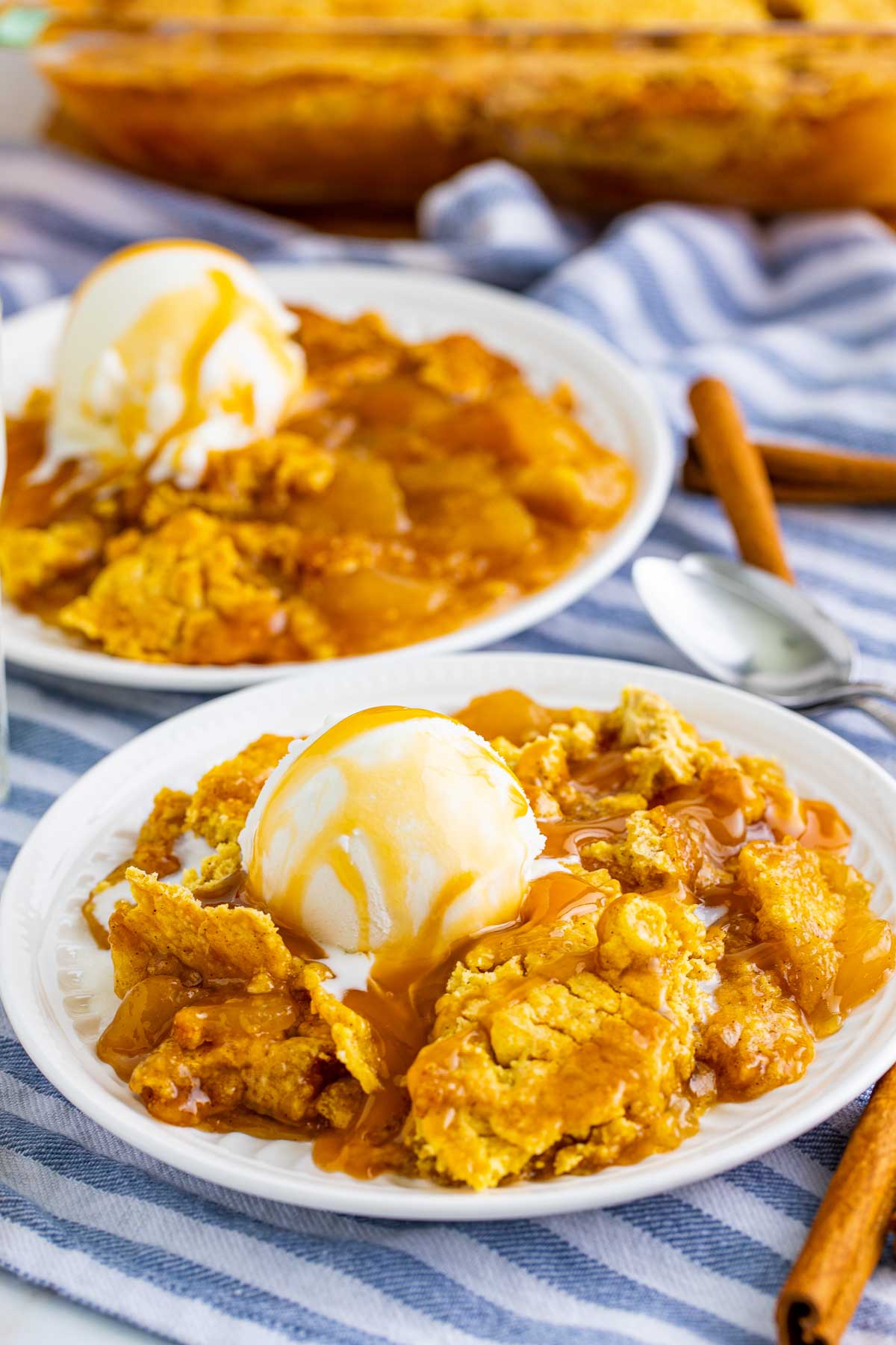 caramel apple dump cake on a white plate