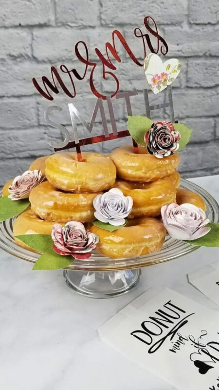 paper flowers on a stack of donuts