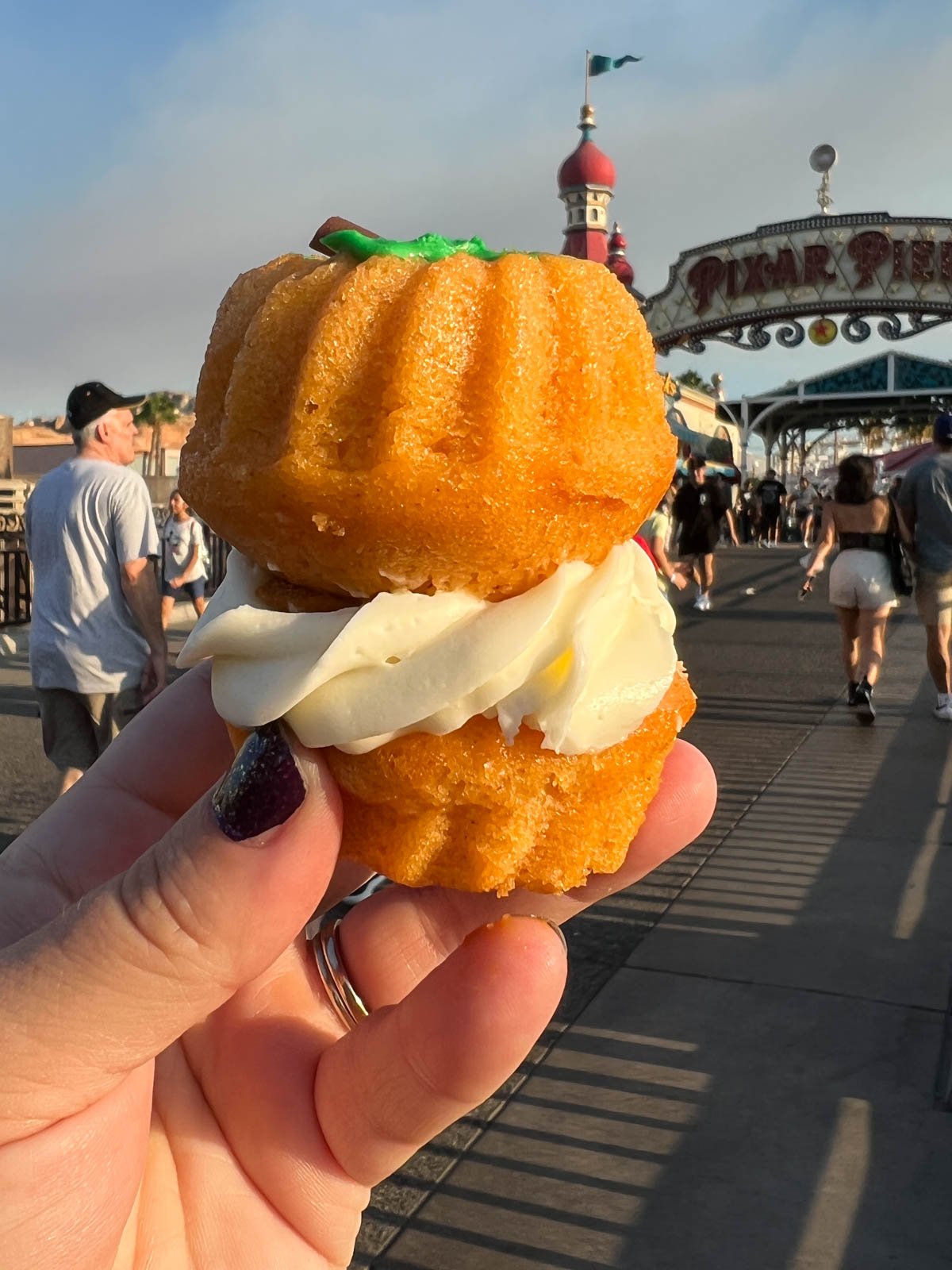 hand holding a pumpkin bundt cake