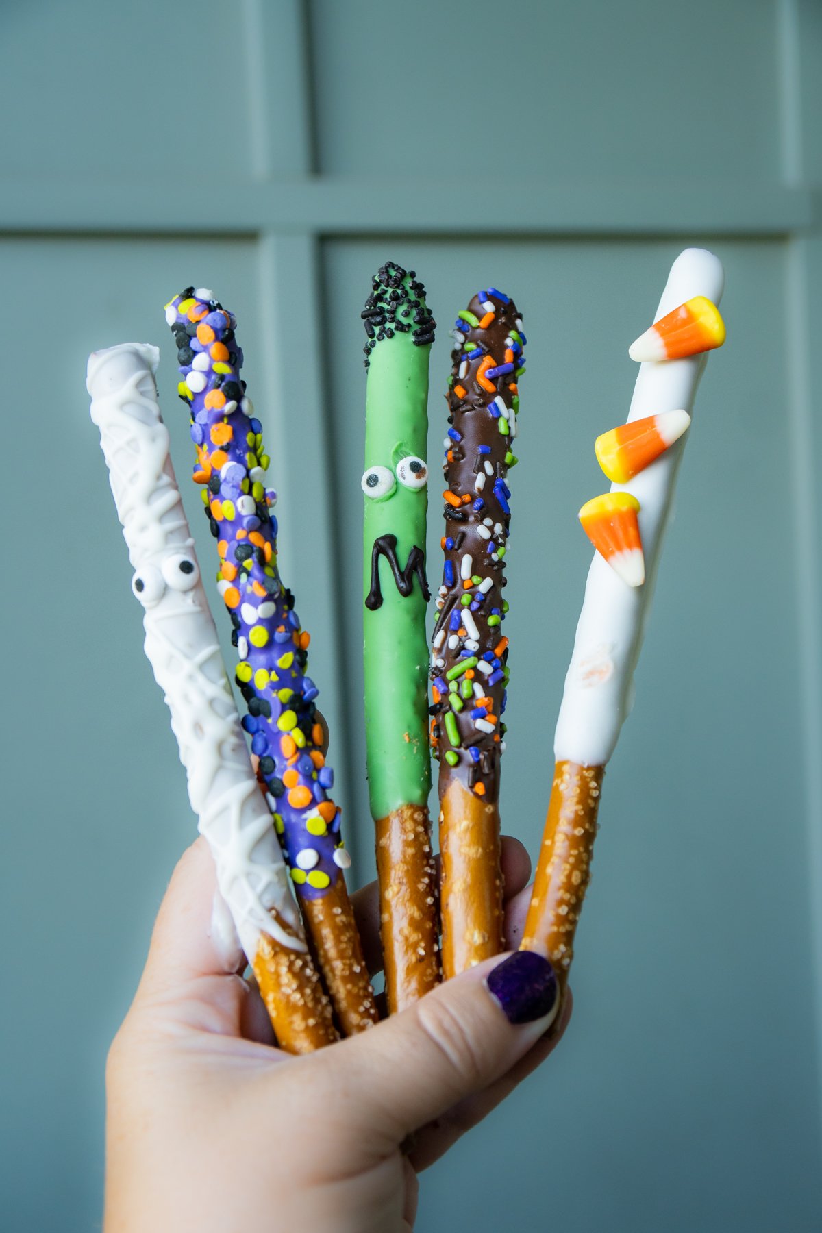 hand holding pretzel sticks