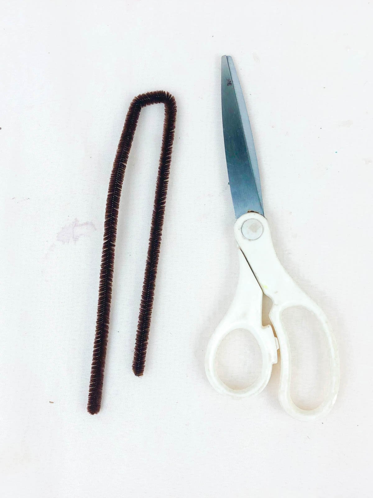 black pipe cleaner cut in half