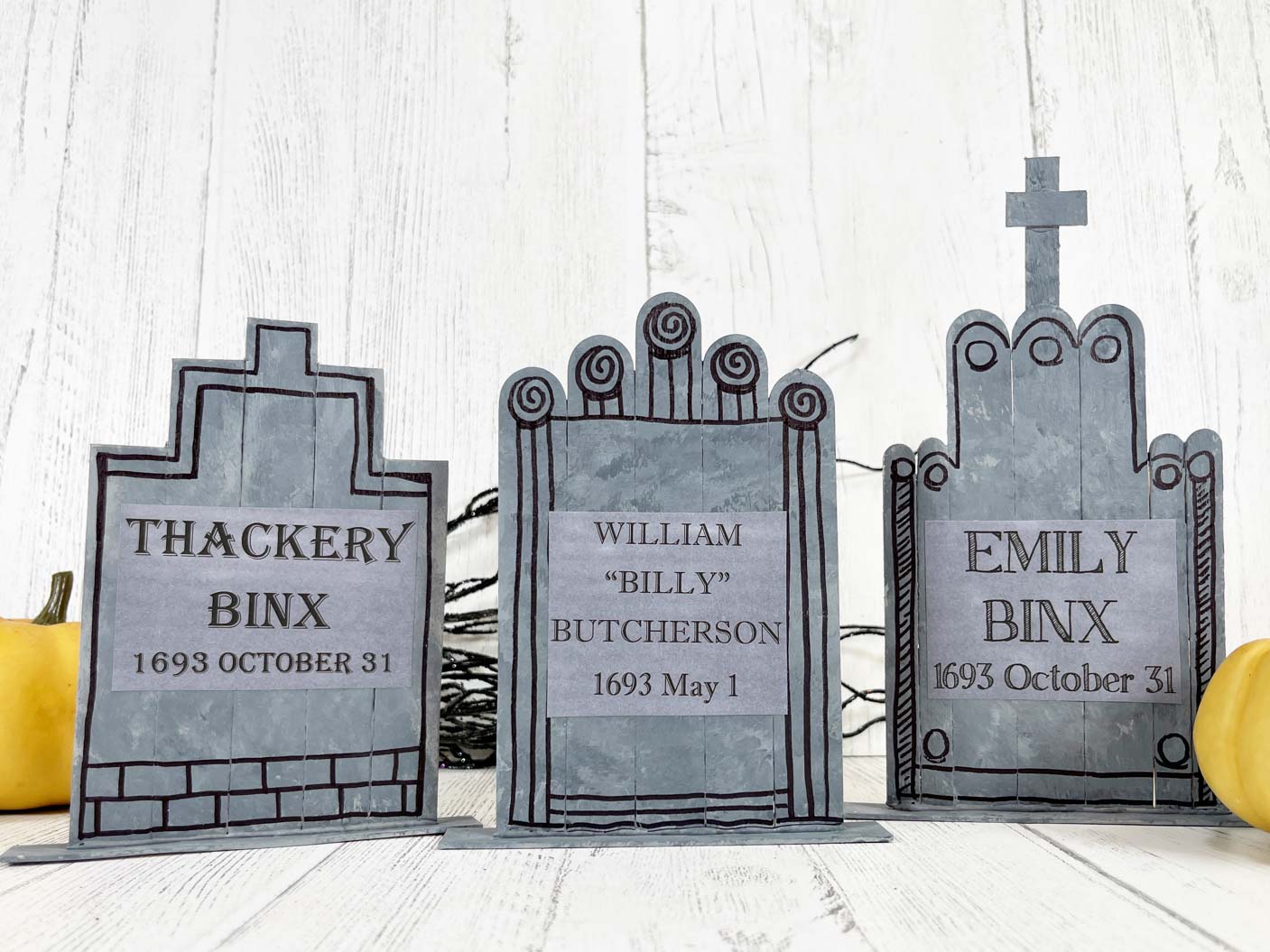 gray tombstones made out of popsicle sticks