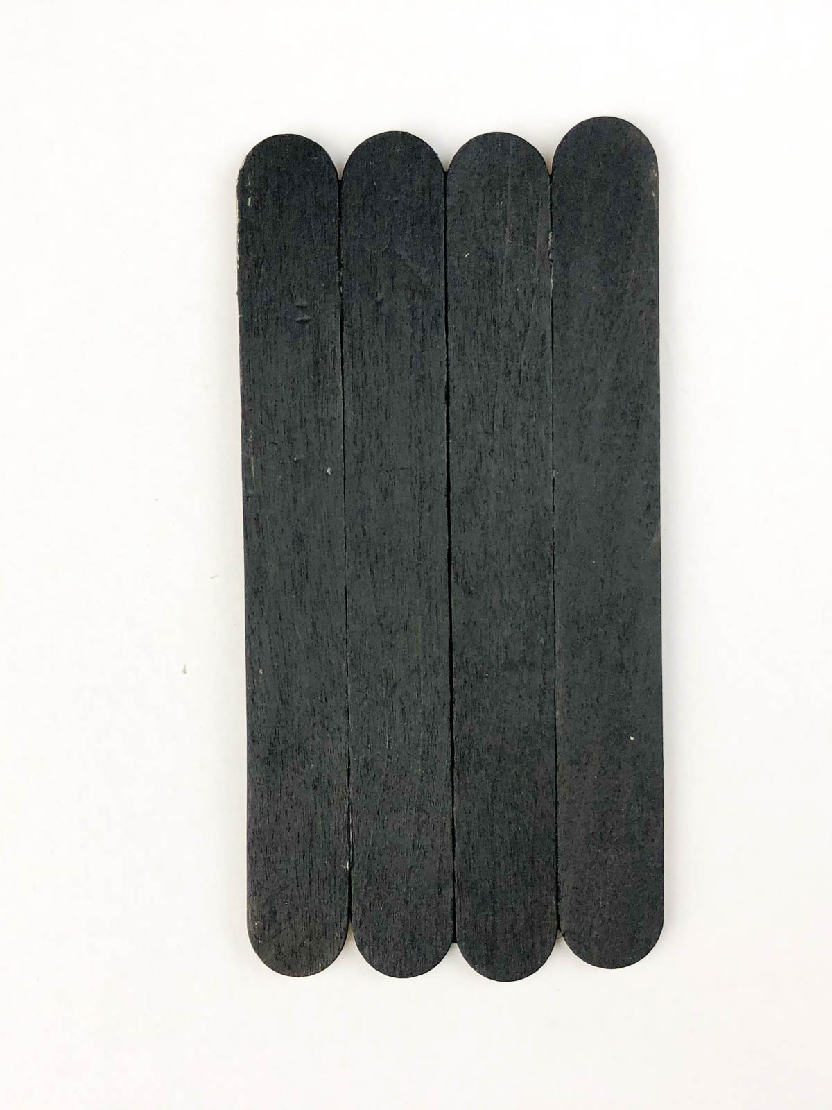 popsicle sticks that are painted black
